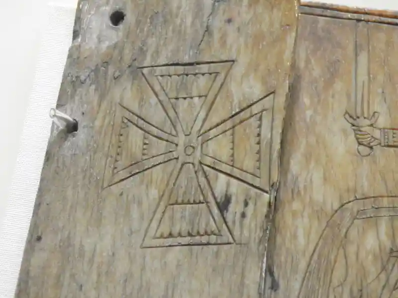 Cludach leabhair, cross carved on wooden cover